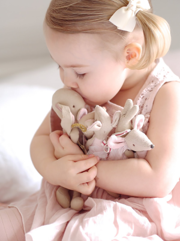 Girl kissing toys